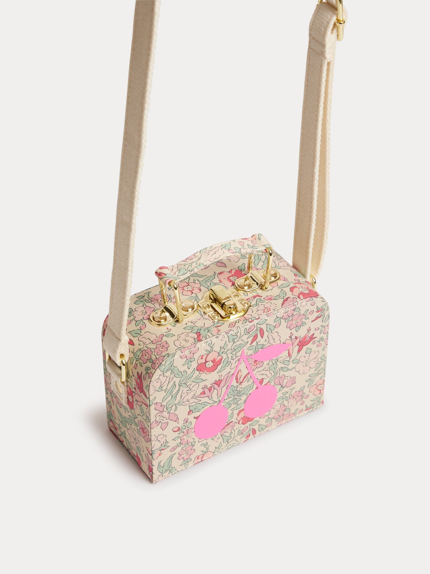 Aimane raspberry-colored suitcase bag in Liberty fabric with a