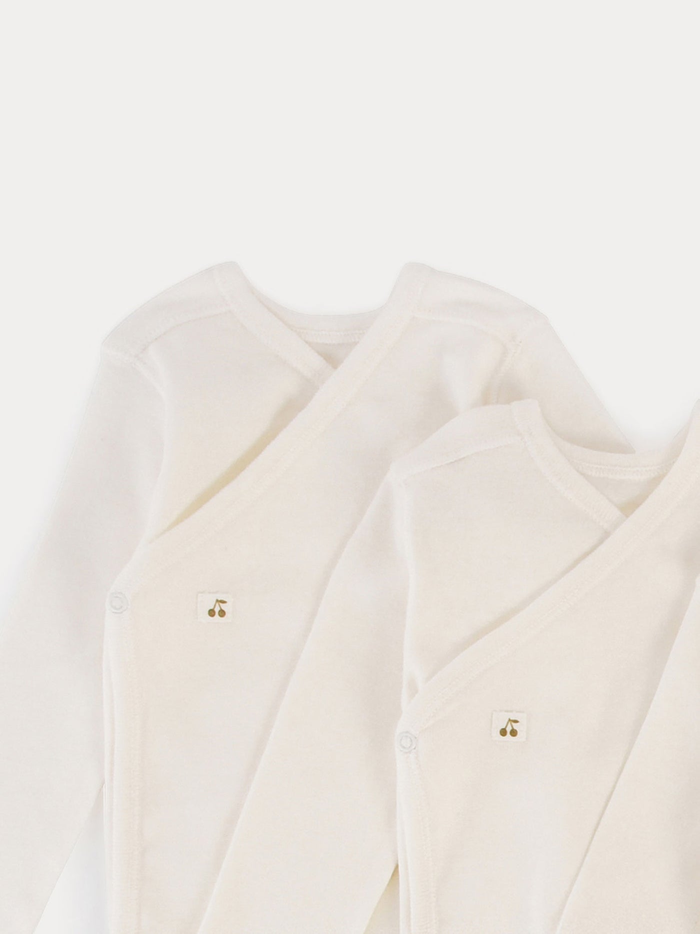 Set of 3 organic cotton wrapover bodysuits in milk-white