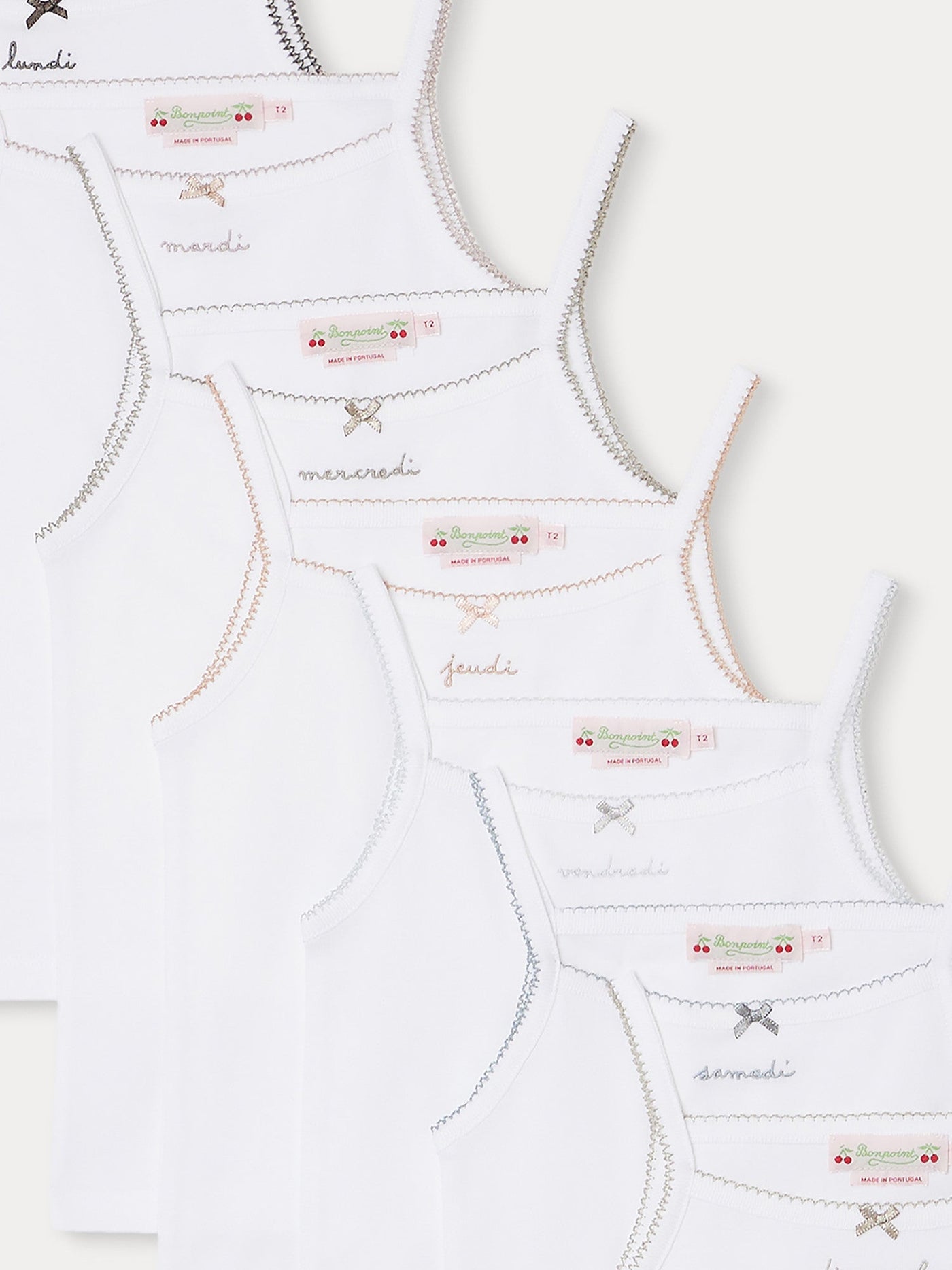 Set of 7 embroidered organic cotton tank tops