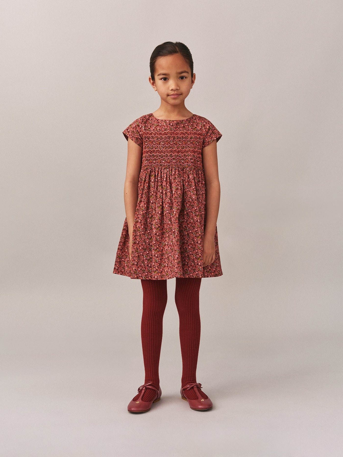 Smocked and embroidered Duchesse dress in Liberty fabric in organic cotton