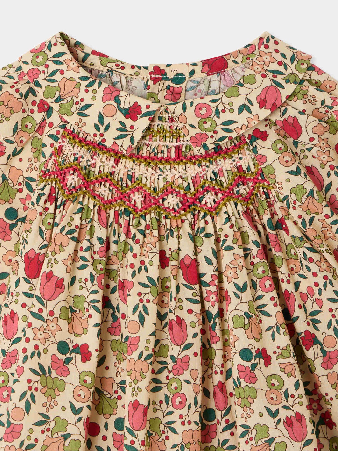 Pompom baby blouse in Liberty fabric smocked and hand-embroidered organic cotton
